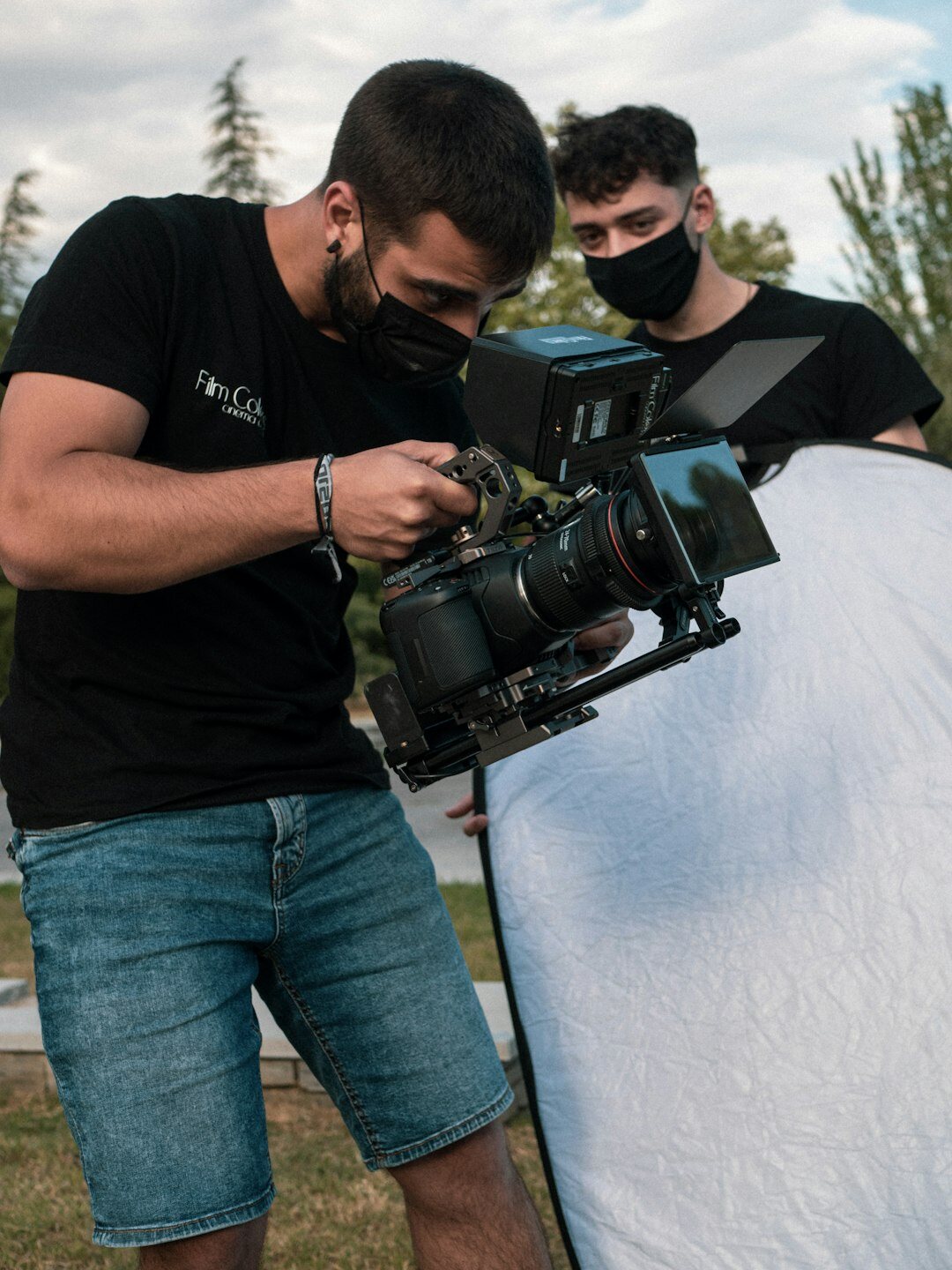 Media coach filming a student with a professional camera