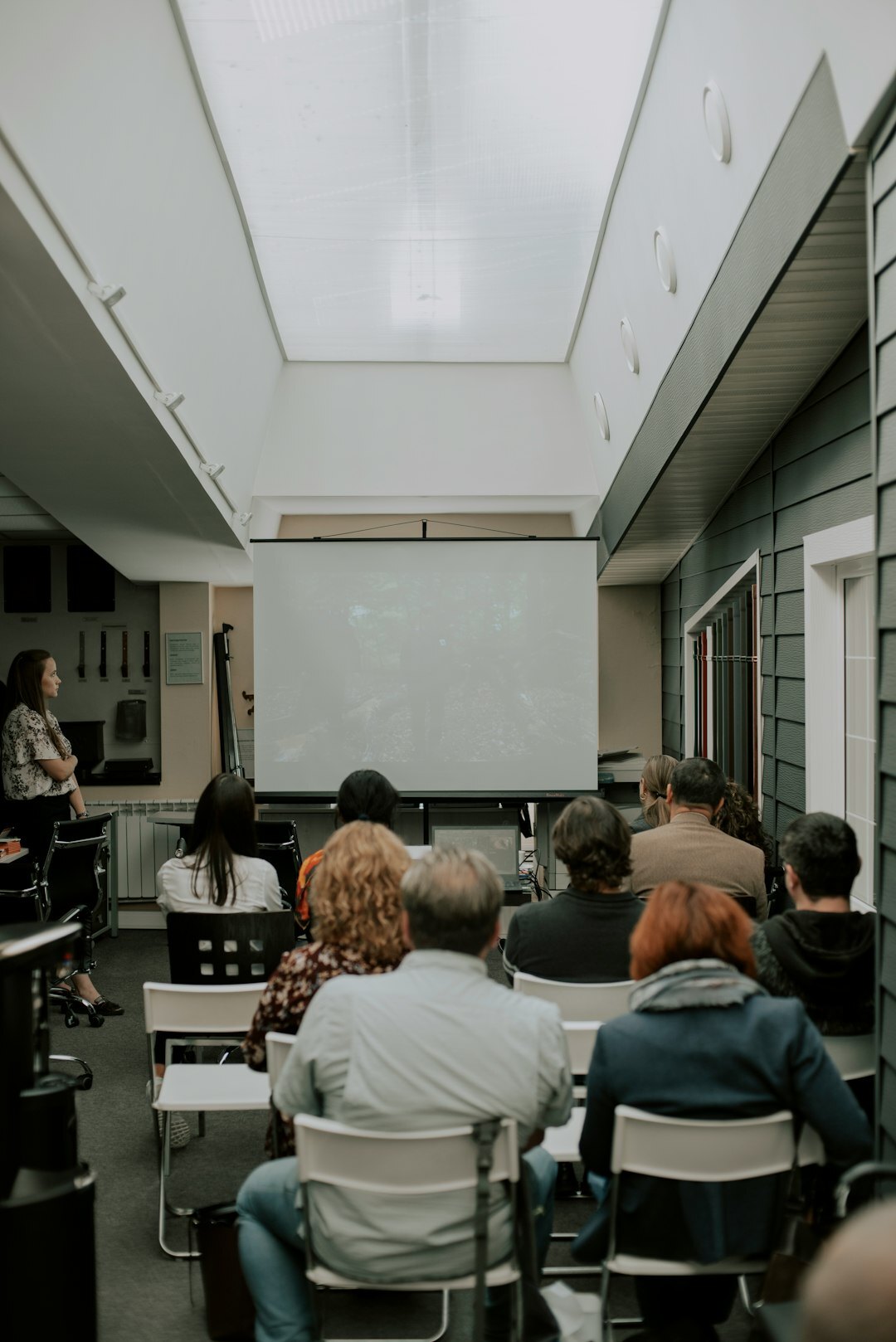 Instructor teaching a group of adult students in a classroom